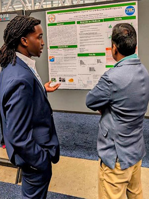 Jamykal Jones, FAMU Junior, discusses drug interaction on specific brain cells.