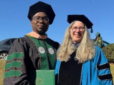 Drs. Olumide Arigbede and Sarah G. Buxbaum post Fall 2024 Commencement. Kudos!